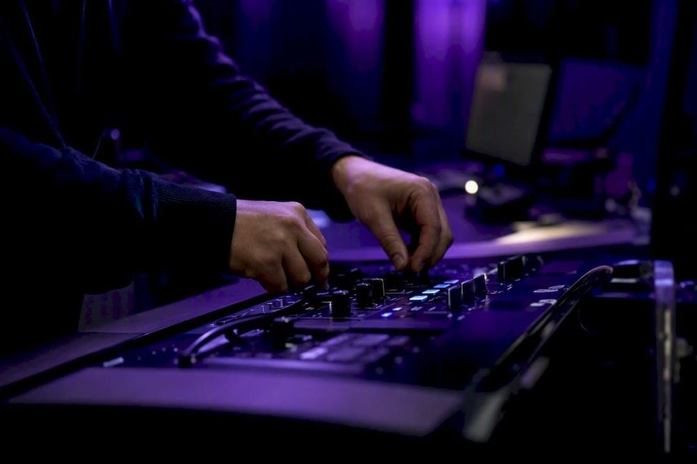 Hands adjusting cybersecurity controls in data center